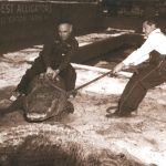 Drysdale and Charlie Usina moving a reluctant alligator.